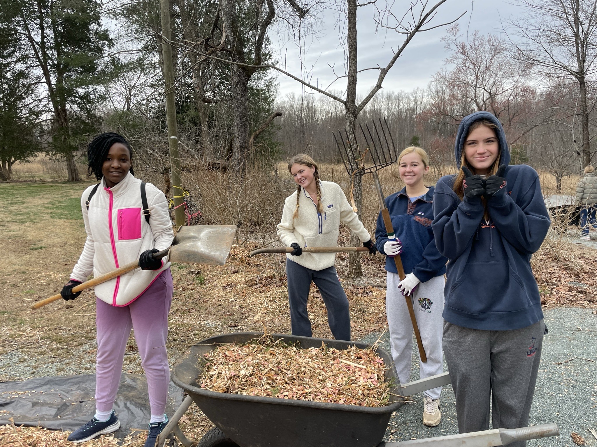 Volunteers with wheelbarrow